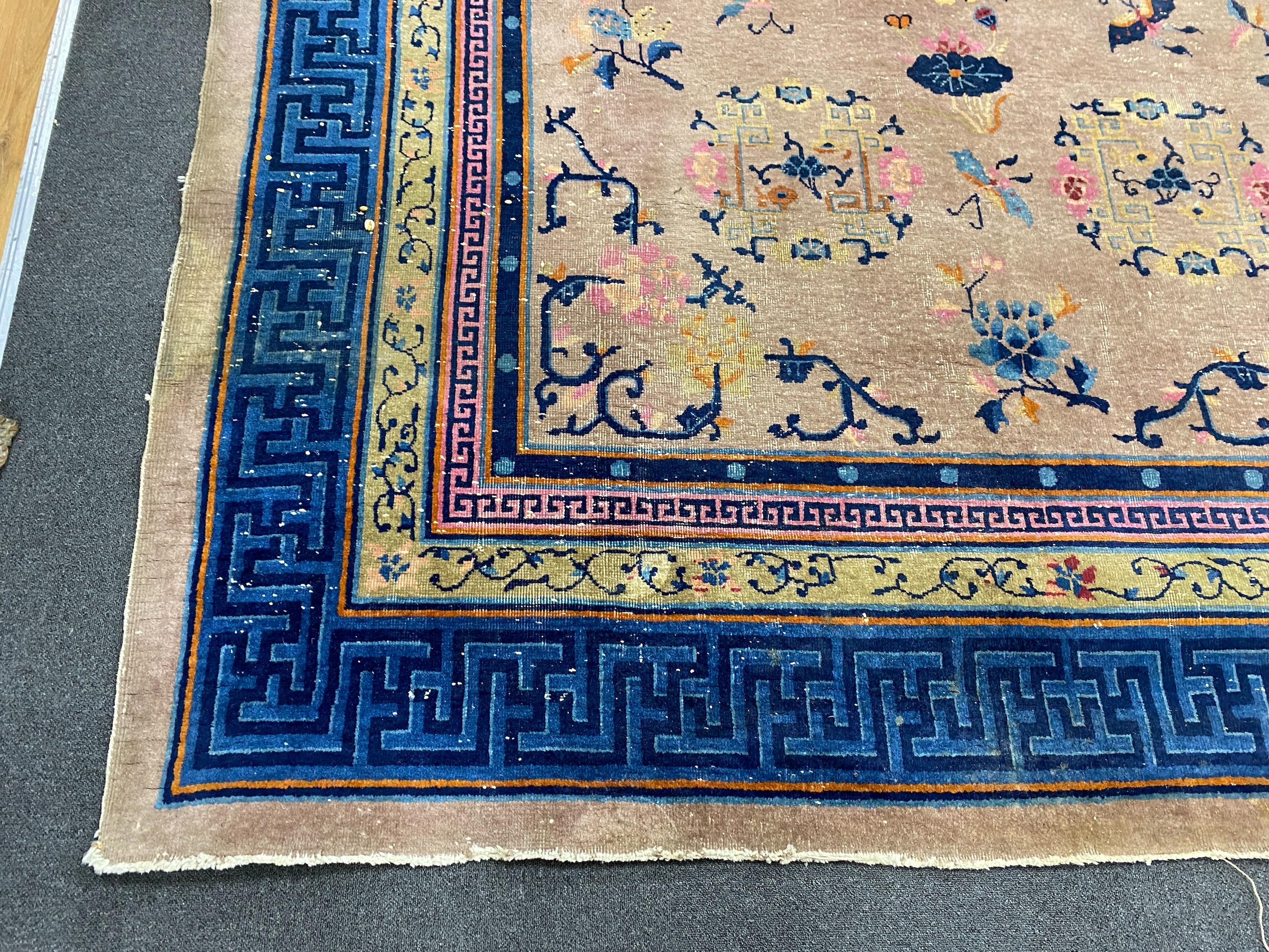 An early 20th century Chinese lilac ground carpet, 330 x 240cm